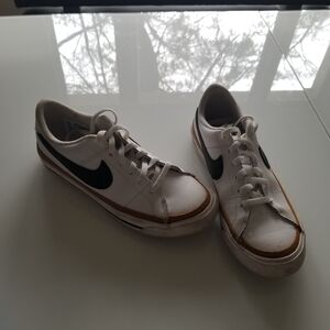 Nike White Leather Sneakers with Black Swoosh and Brown Trim